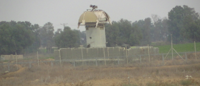 Surveillance tower in the buffer zone in Khuza’a, occupied Gaza Strip. Photo by Corporate Watch, November 2013