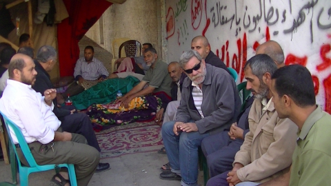 Basil Alsh Shawa (in sunglasses) at a sit-in by the families of the victims of the 2009 and 2012 Israeli massacres - Photo taken by Corporate Watch, November 2013