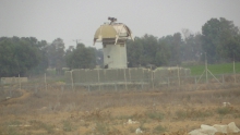 Surveillance tower in the buffer zone in Khuza’a, occupied Gaza Strip. Photo by Corporate Watch, November 2013